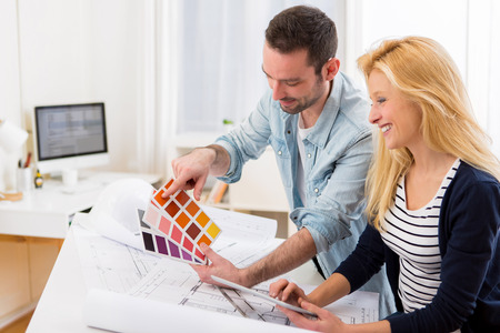 View of Two attractives architect working at the officeの写真素材