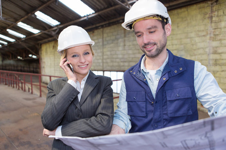 View of a Enginneer and worker working on a brownfieldの写真素材