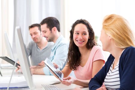 View of Young attractive people working together at the officeの写真素材
