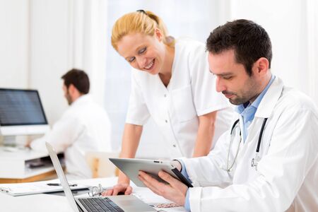 View of a Doctor and an assistant working together at the hospitalの写真素材