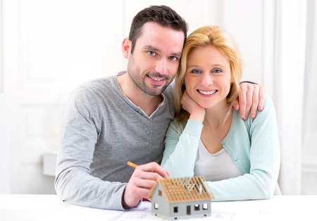 View of a Young attractive 30s couple making home projectの写真素材