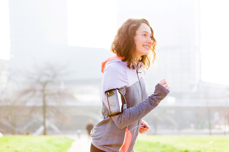 View of a Young attractive woman running at the parkの写真素材
