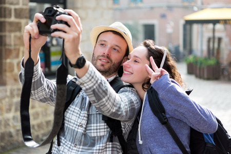 View of a Young couple on holidays taking selfieの写真素材