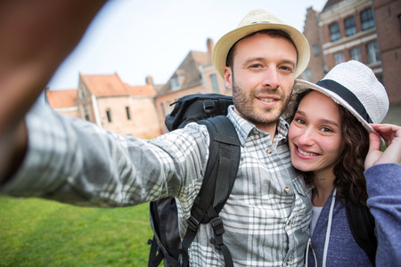 View of a Young couple on holidays taking selfieの写真素材