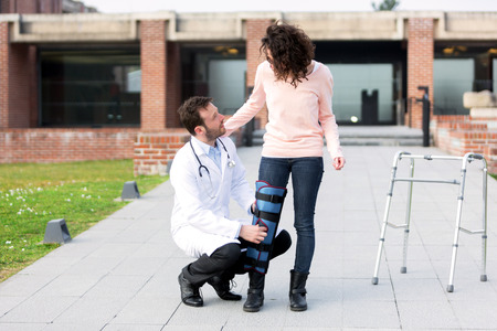 View of a Young doctor assisting a young womanの写真素材