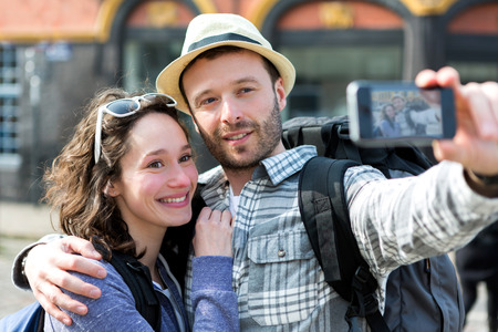 View of a Young couple on holidays taking selfieの写真素材