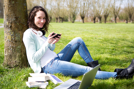 View of a Young attractive woman realxing at the parkの写真素材