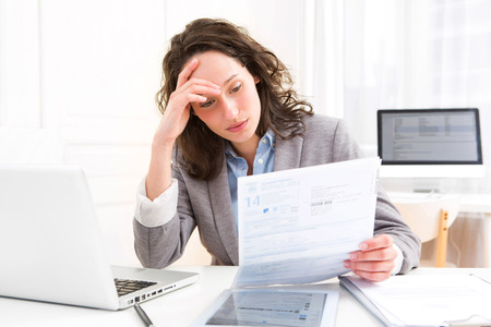 View of a Young attractive woman doing paperworkの写真素材