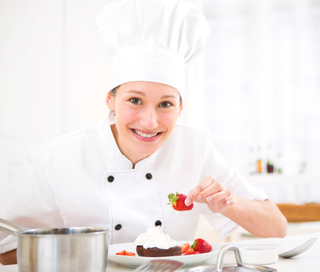 View of a Young attractive professional chef cooking in his kitchenの写真素材