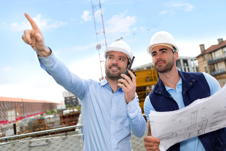 View of a Worker and architect watching some details on a constructionの写真素材