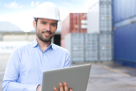 View of a Young Attractive engineer using laptop on the dockの写真素材