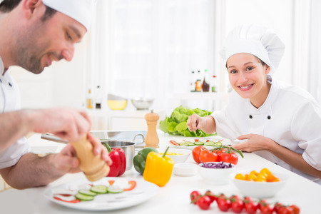 View of a Young attractive professional chef cooking in his kitchenの写真素材