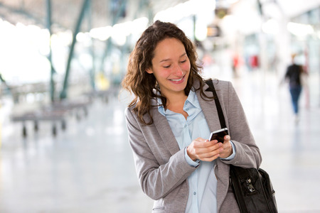 View of a Young attractive business woman using smartphoneの写真素材