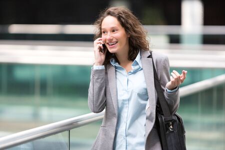 View of a Young attractive business woman using smartphoneの写真素材