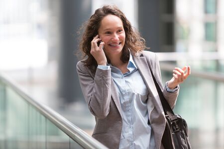 View of a Young attractive business woman using smartphoneの写真素材