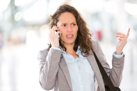 View of a Young attractive business woman using smartphoneの写真素材
