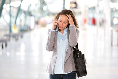 View of a Young attractive business woman using smartphoneの写真素材