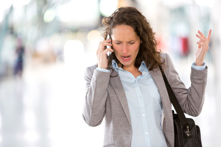 View of a Young attractive business woman using smartphoneの写真素材