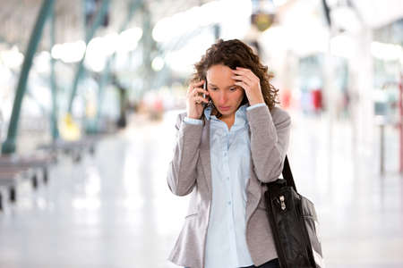 View of a Young attractive business woman using smartphoneの写真素材