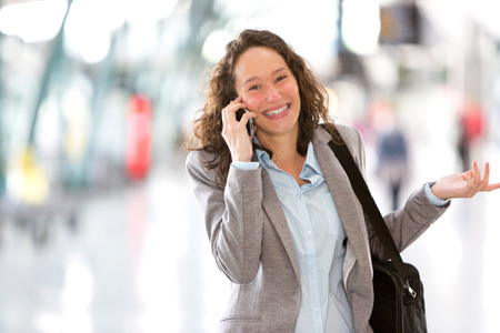 View of a Young attractive business woman using smartphoneの写真素材