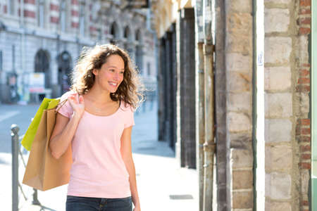 View of a Young attractive happy woman shopping in the cityの写真素材