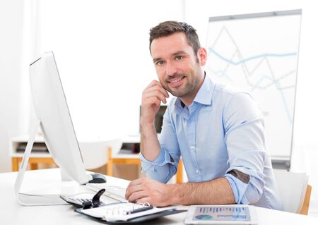 View of a Young attractive businessman at the officeの写真素材