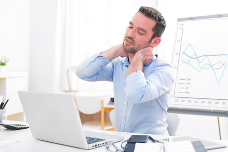 View of a Young attractive business feeling pain because of burn outの写真素材