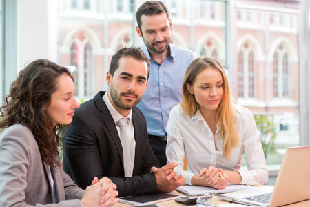 View of a Group of business people working together at the officeの写真素材