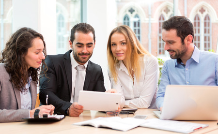 View of a Group of business people working together at the officeの写真素材