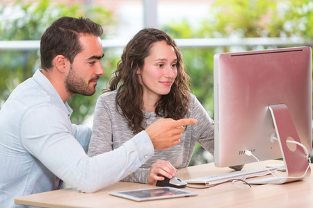 View of a Young attractive people taking a training course with formatorの写真素材
