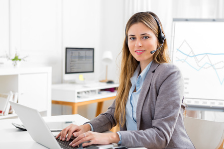 View of a Young attractive woman working at the officeの写真素材