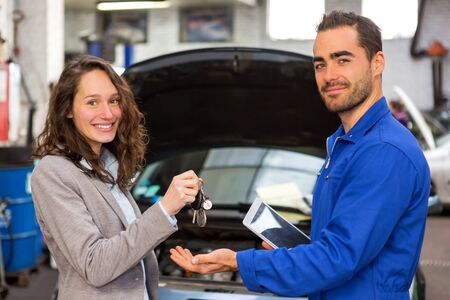 View of a Customer and a mechanic at the garageの写真素材