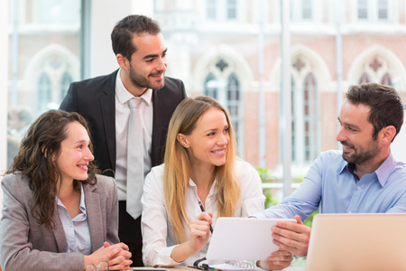 View of a Group of business people working together at the officeの写真素材
