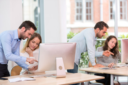 View of a Young attractive people taking a training course with formatorの写真素材