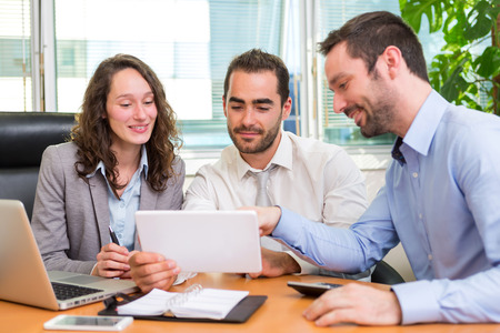 View of a Group of business associates working together at the officeの写真素材