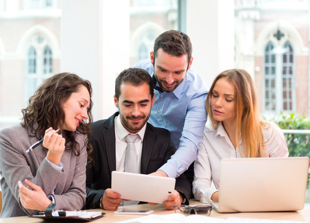 View of a Group of business people working together at the officeの写真素材