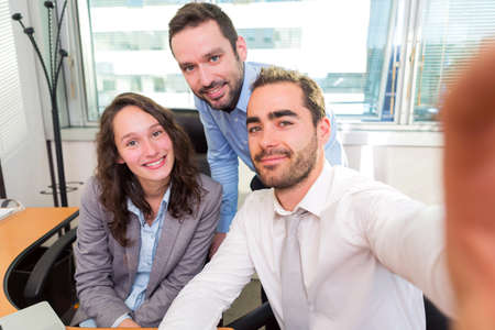 View of a Group of business associates working together at the officeの写真素材