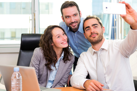 View of a Group of business associates working together at the officeの写真素材