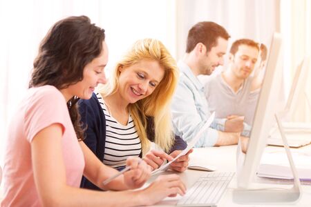 View of a Young attractive people working together at the officeの写真素材