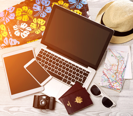 View of a Wood tourist's desk in high definition with laptop, tablet and mobileの写真素材
