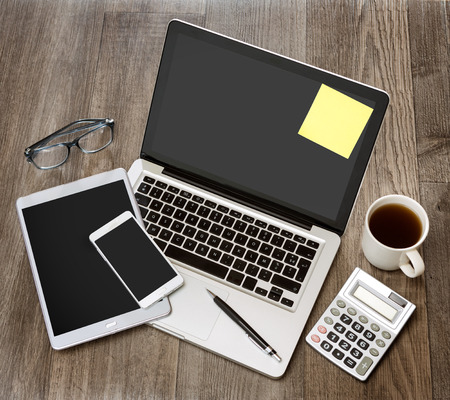 View of a Wood businessman's desk in high definition with laptop, tablet and mobileの写真素材