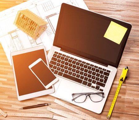 View of a Wood architect's desk in high definition with laptop, tablet and mobileの写真素材