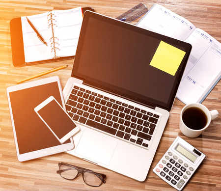 View of a Wood businessman's desk in high definition with laptop, tablet and mobileの写真素材