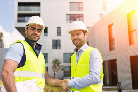 View of a Worker and architect watching some details on a construction