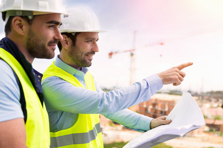 View of a Worker and architect watching some details on a construction