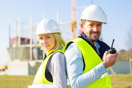 View of a team of two workers on a construction siteの写真素材
