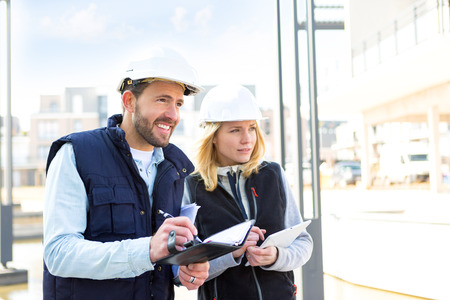 View of a Engineer and architect dating next appointment on a construction siteの写真素材