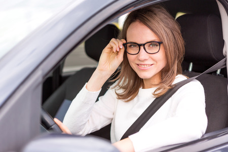 View of a Young attractive woman driving his carの写真素材
