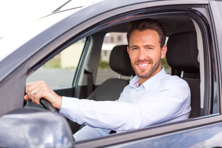 View of a Young attractive man driving his carの写真素材