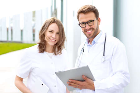 View of Two doctors working in front of the clinicの写真素材